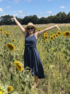 Business Coach in a field of sunflowers